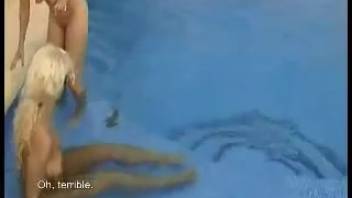 Blonde duo engages in scat play in the swimming pool